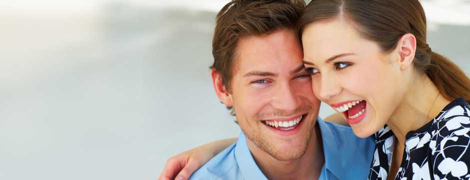 Happy couple smiling after their visit to Dr. Wilkins Family Dentistry